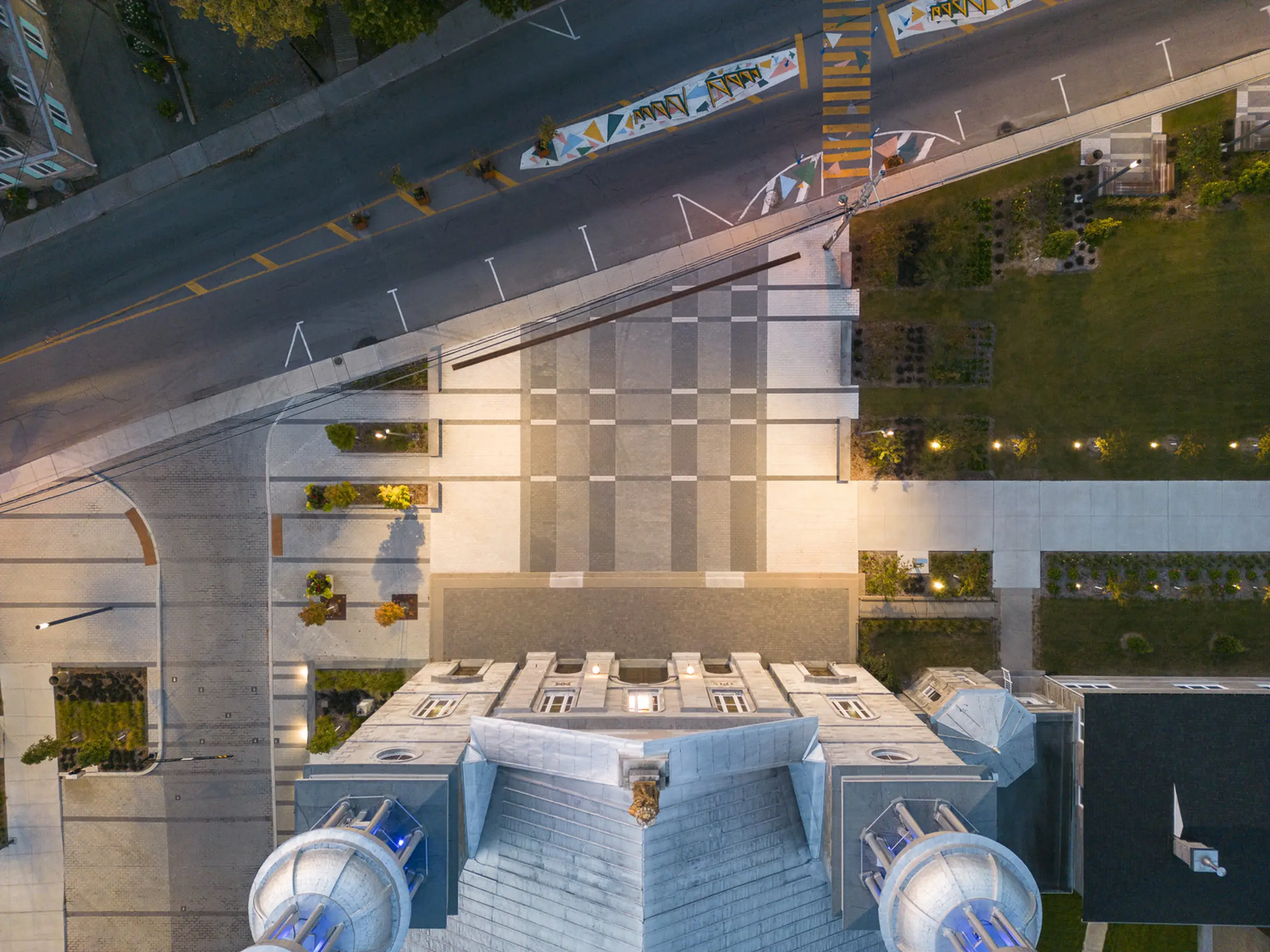 Church plaza at night - Berge des Baigneurs project in Laval