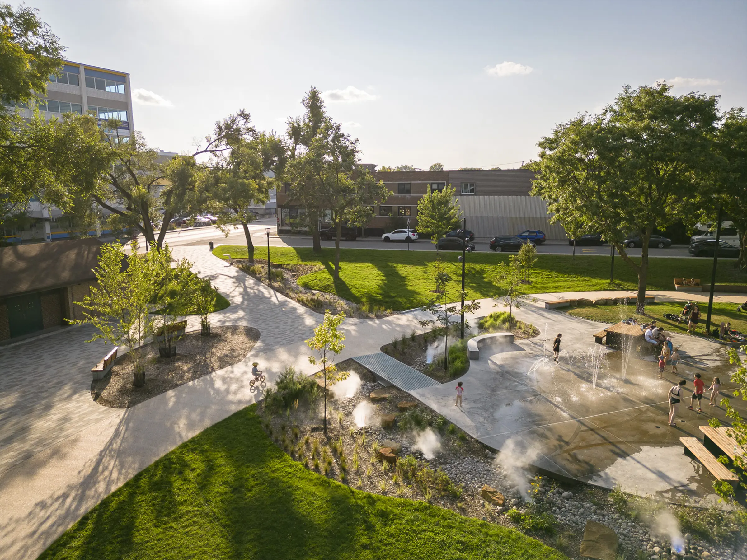 Lush vegetation and splash pad - Rosemont Park oasis