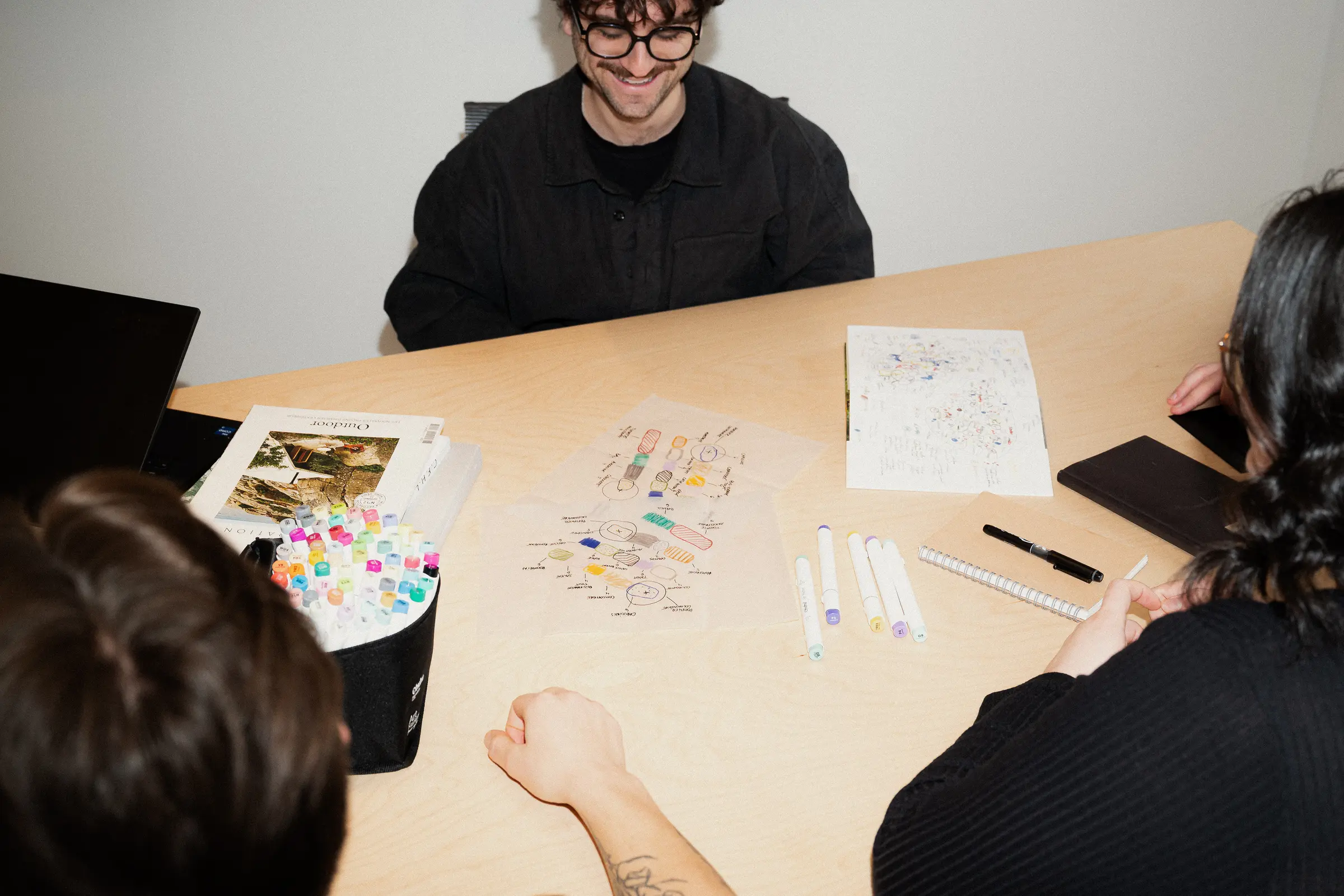 Colleagues working at the drafting table